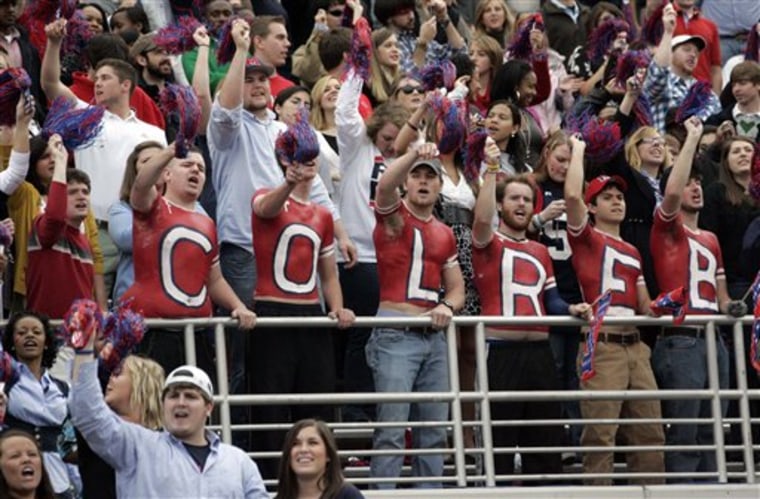 In a Nov. 11, 2009 photo, Colonel Reb, the beloved Old South gentleman banished from the sidelines nearly seven years ago, is fondly endorsed by a group of students at a football game in Oxford, Miss. Students will take a yes or no vote on Tuesday for a new mascot. (AP Photo/Rogelio V. Solis)